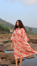 Front view of a free size summer dress in pink floral print made from breathable rayon cotton with a relaxed fit.