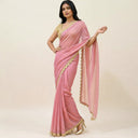 Rosé Veil pink organza saree with gold scallop border worn in full drape