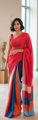 Front view of scarlet red satin saree with fluid drape and colour-blocked pallu