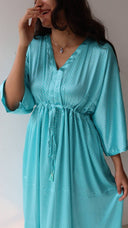 Adjustable waist tie on light blue satin polka dot dress