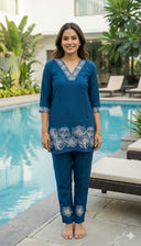 Teal Magnolia embroidered co ord set with kurta and pants by Label Anaira