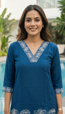 Teal Magnolia co ord set featuring embroidered V neckline and sleeves