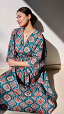 Teal printed linen cotton free size dress with pockets for women in natural sun light