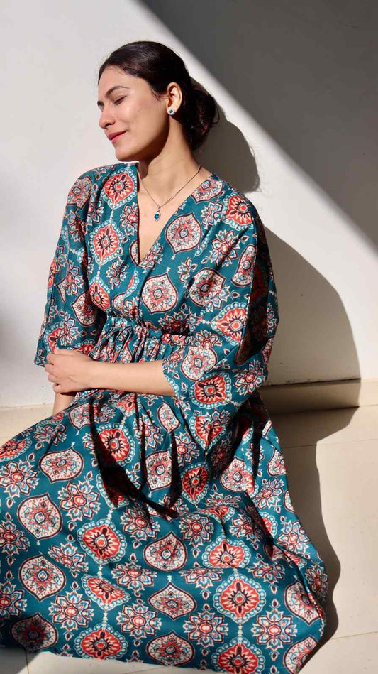 Teal printed linen cotton free size dress with pockets for women in natural sun light