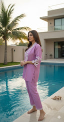 Side view of lilac co-ord set with white embroidery